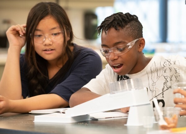Students with a stream table.