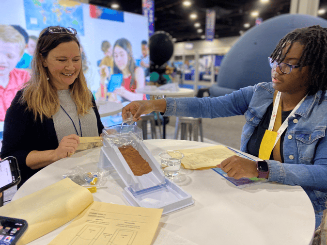 Teachers using a stream table.