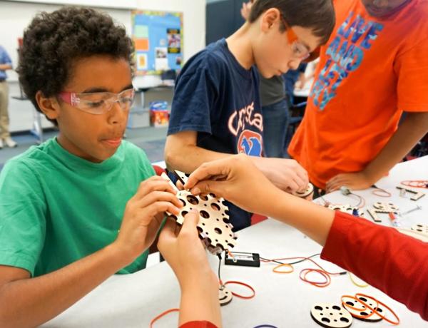 a group of elementary students collaborate on a PBL STEM project