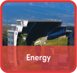 Label "Energy" superimposed over image of skyscraper set against mountain backdrop