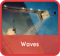 Word "waves" superimposed over image of large satellite dish receiver